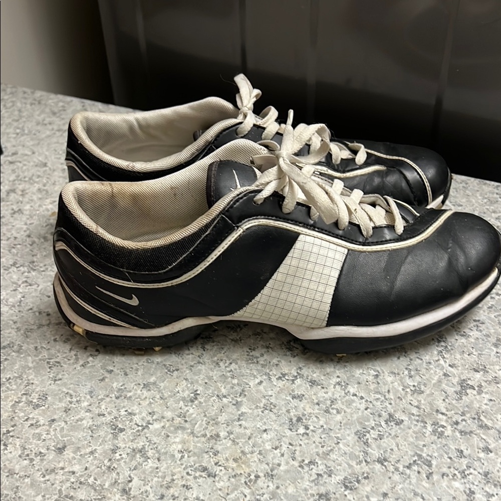 Nike Black and White woman’s golf cleat shoes